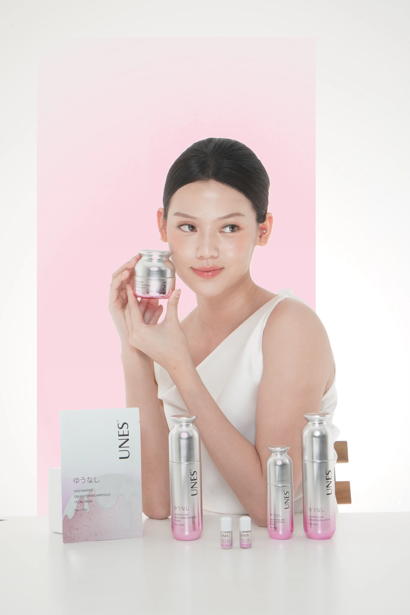 UNES model with the Aurora Glow skincare range