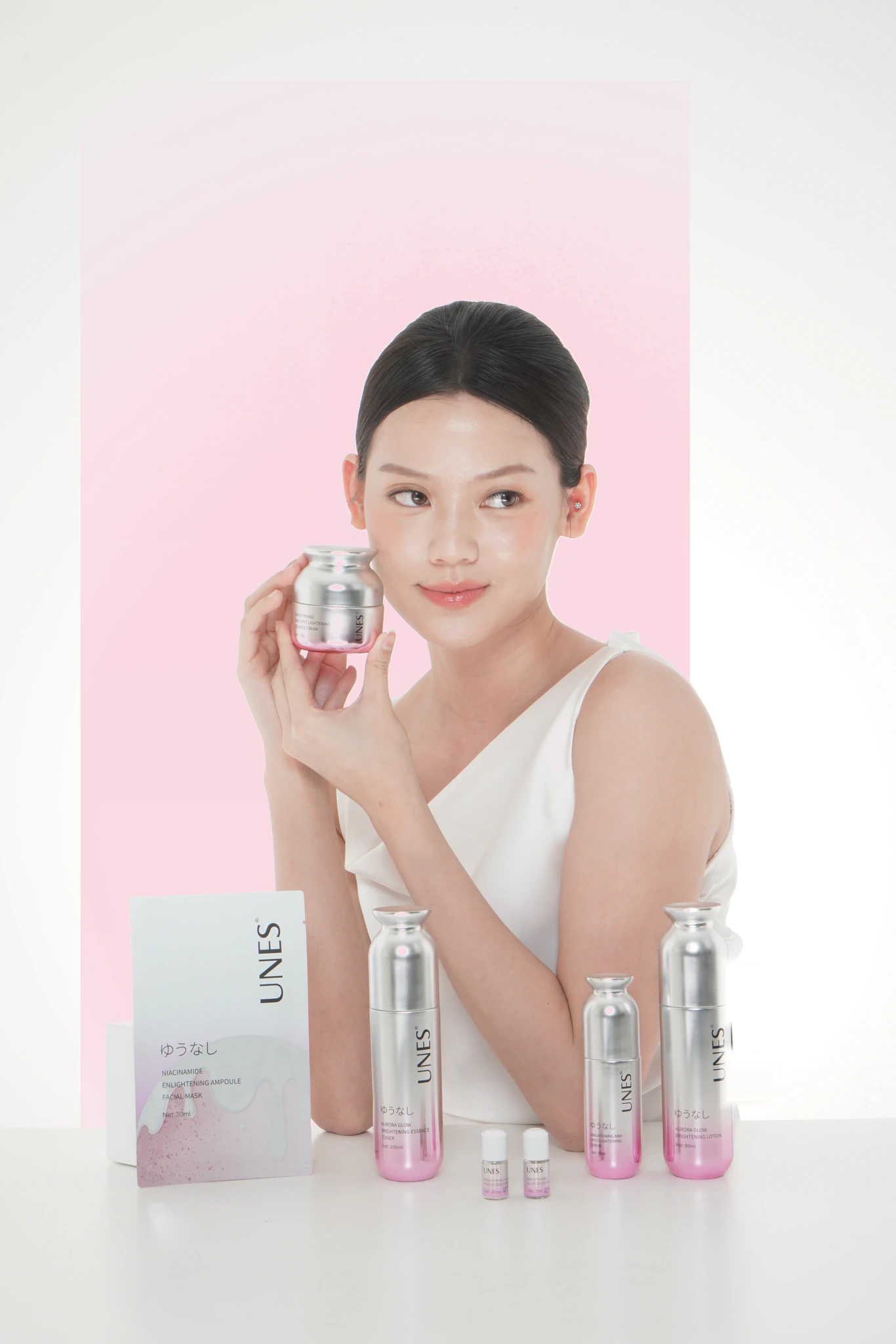 UNES model with the Aurora Glow skincare range